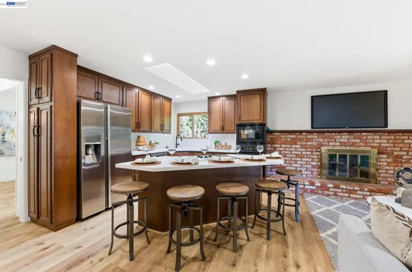 a kitchen with a sink stove and microwave
