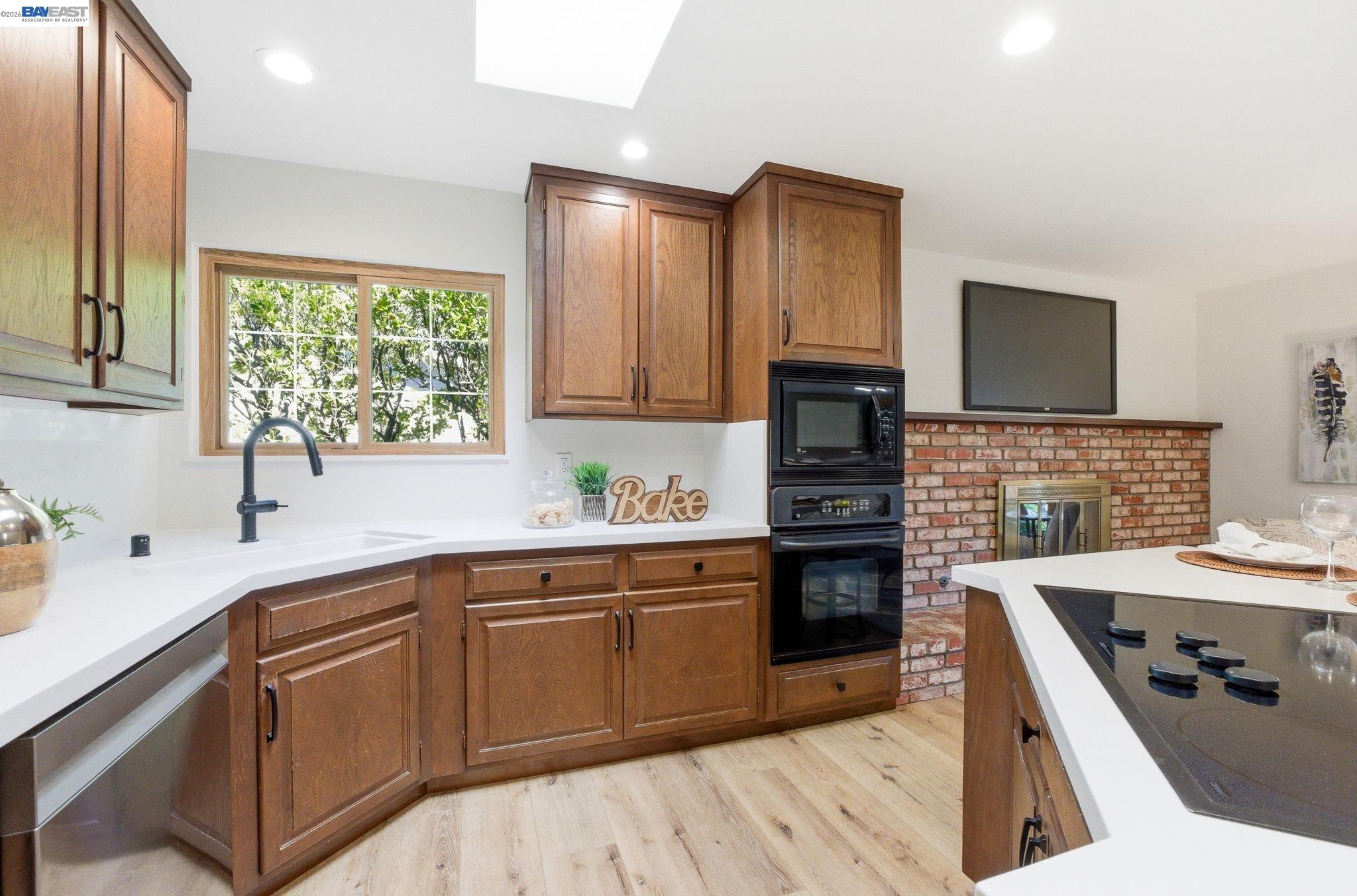 2645 Swanson Way Mountain View, CA 94040 - Photo 30 of 50 a kitchen with a sink stove and microwave