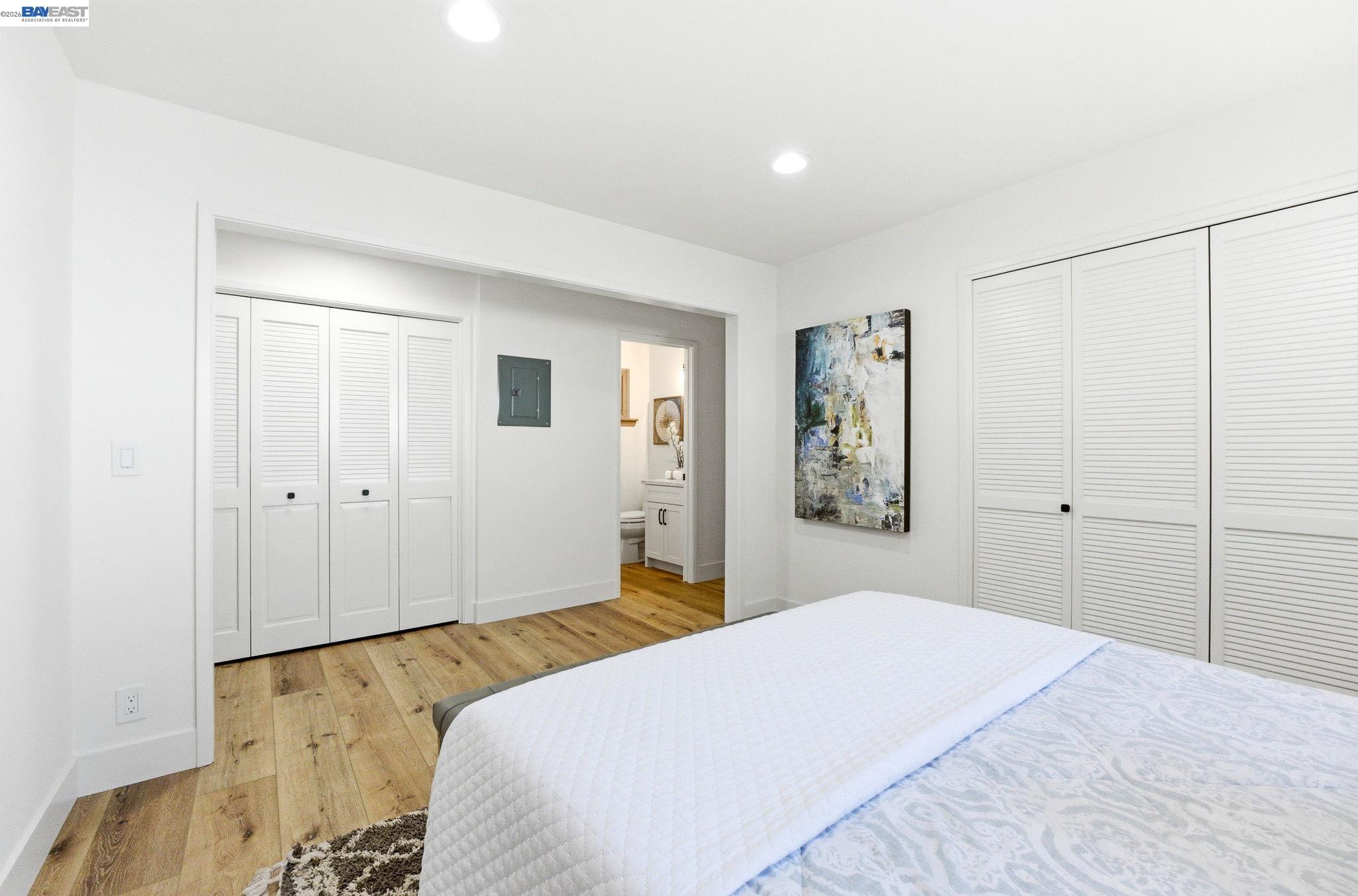 2645 Swanson Way Mountain View, CA 94040 - Photo 37 of 50 a bedroom with a large bed and wooden floor