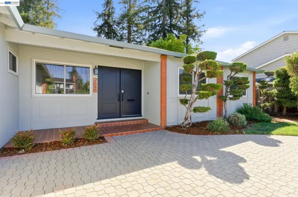 a front view of a house with a garage