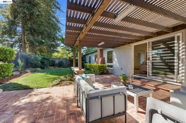 a view of yard with patio