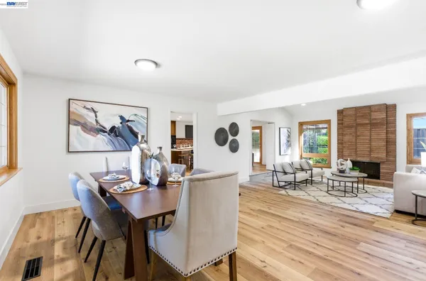 a view of a dining room with furniture and a wooden floor