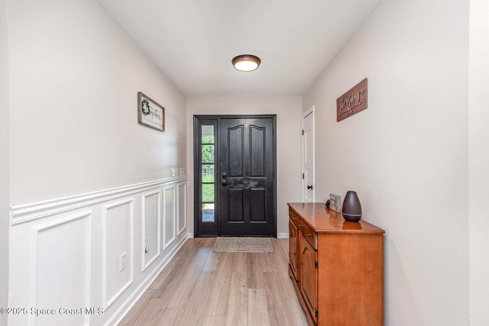 3310 Grant Line Road Mims, FL 32754 - Photo 3 of 38 a view of hallway with washer and dryer