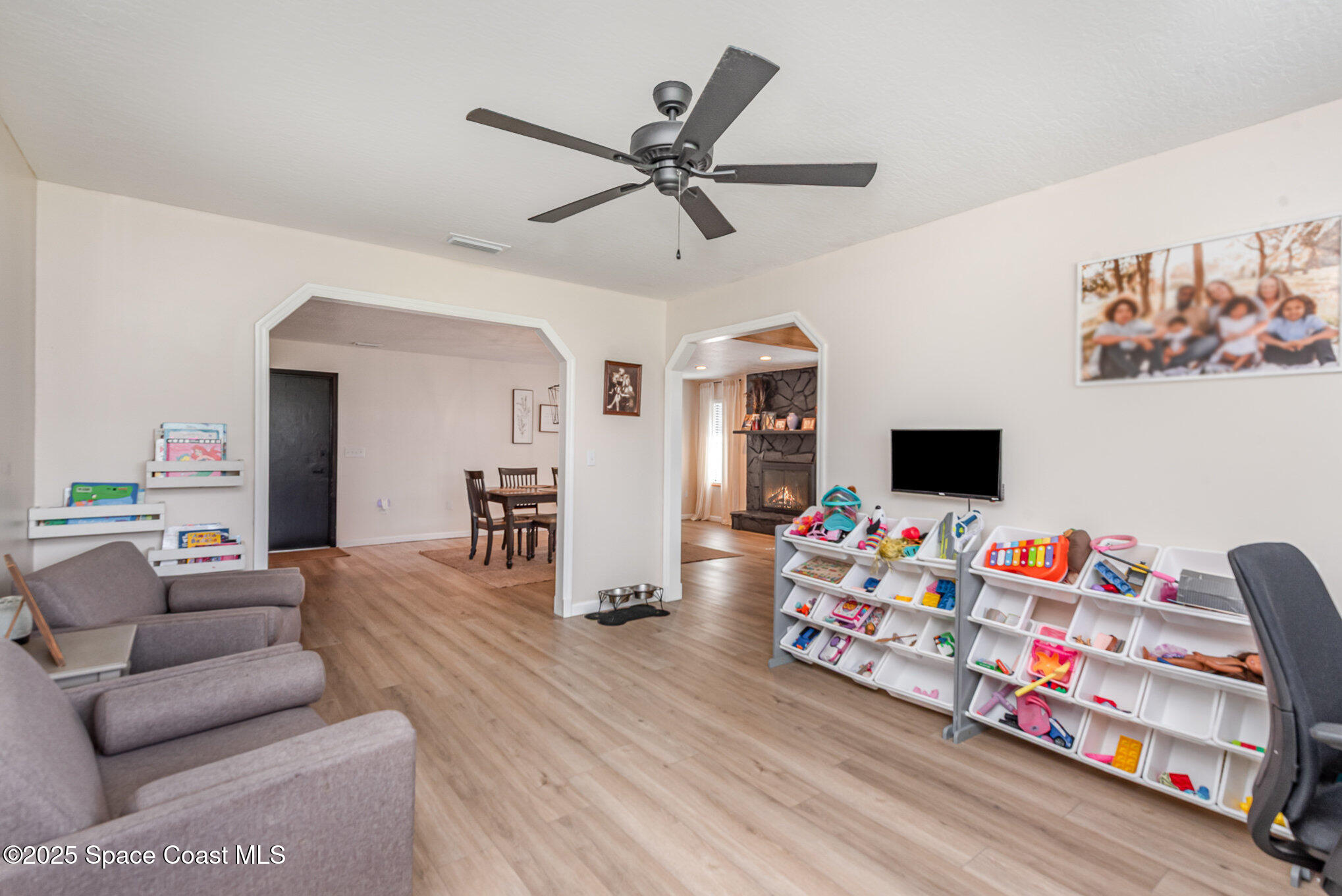 3310 Grant Line Road Mims, FL 32754 - Photo 4 of 38 a living room with furniture and a flat screen tv