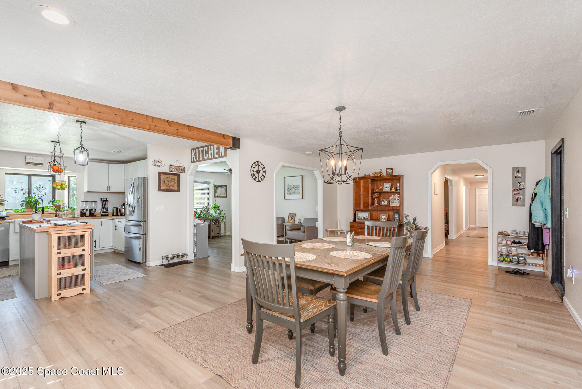 3310 Grant Line Road Mims, FL 32754 - Photo 8 of 38 a view of a dining room with furniture and wooden floor