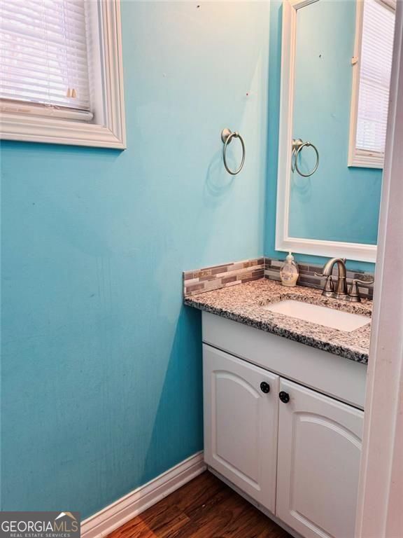 543 Saddle Ridge Drive Bethlehem, GA 30620 - Photo 17 of 36 a bathroom with a granite countertop sink and a mirror