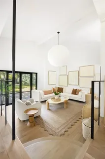 a view of a living room and kitchen floor