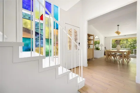 a view of a livingroom with furniture and a window