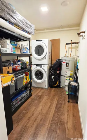 a utility room with dryer washer and other items