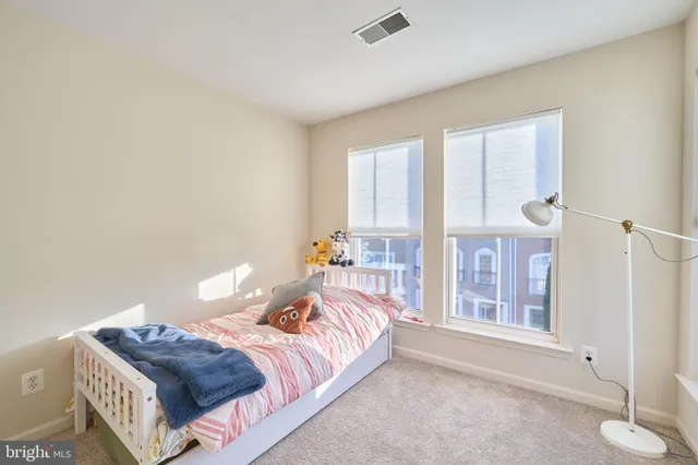 a bedroom with a bed and a closet