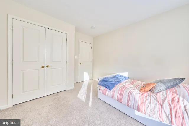 a bathroom with a toilet a sink a mirror a bathtub and shower