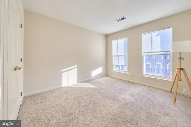 a bedroom with a bed and a book shelf
