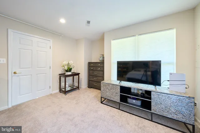 a bedroom with a bed and furniture