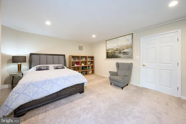 a bathroom with a sink mirror and shower