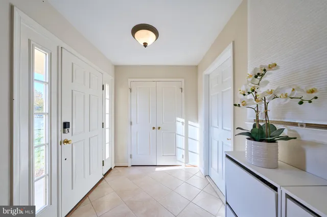 a view of room with stairs and wooden floor