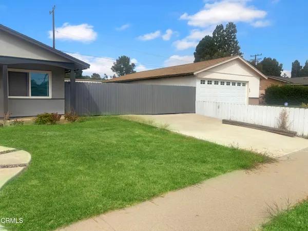 a view of a back yard of the house