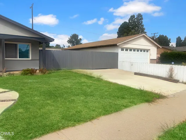 a view of a back yard of the house