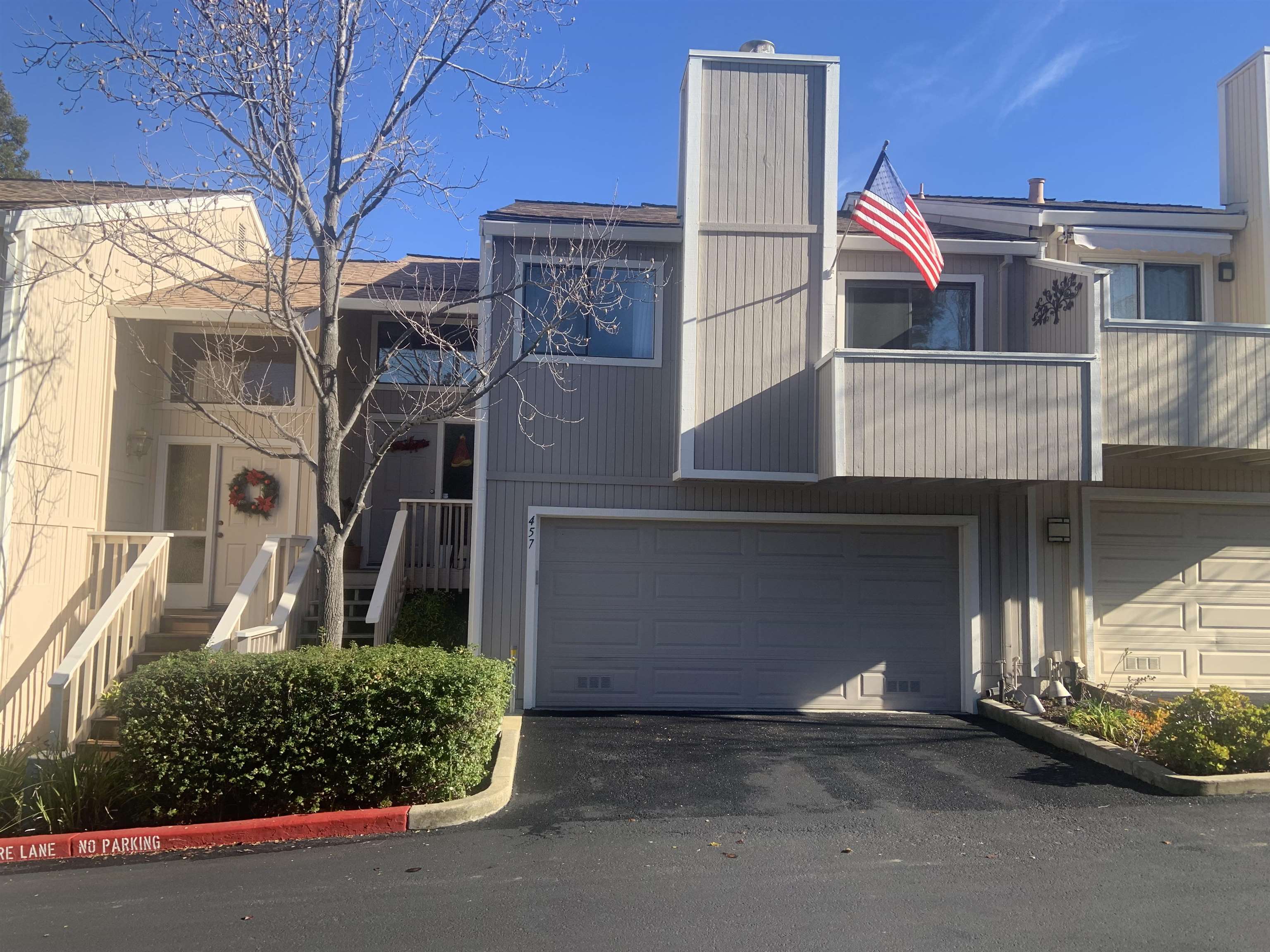 a front view of a house with a garage