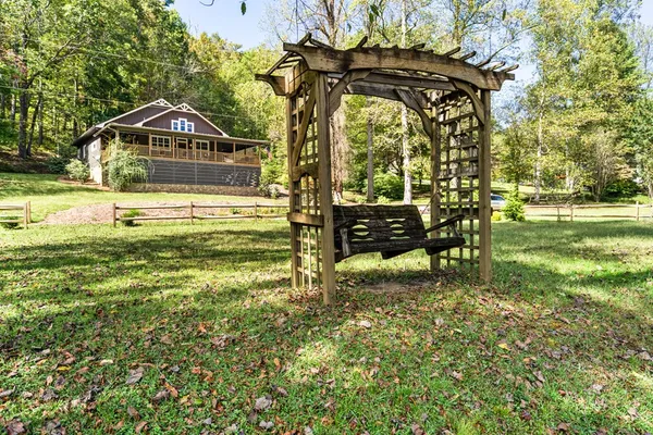 a view of outdoor space with wooden floor and furniture