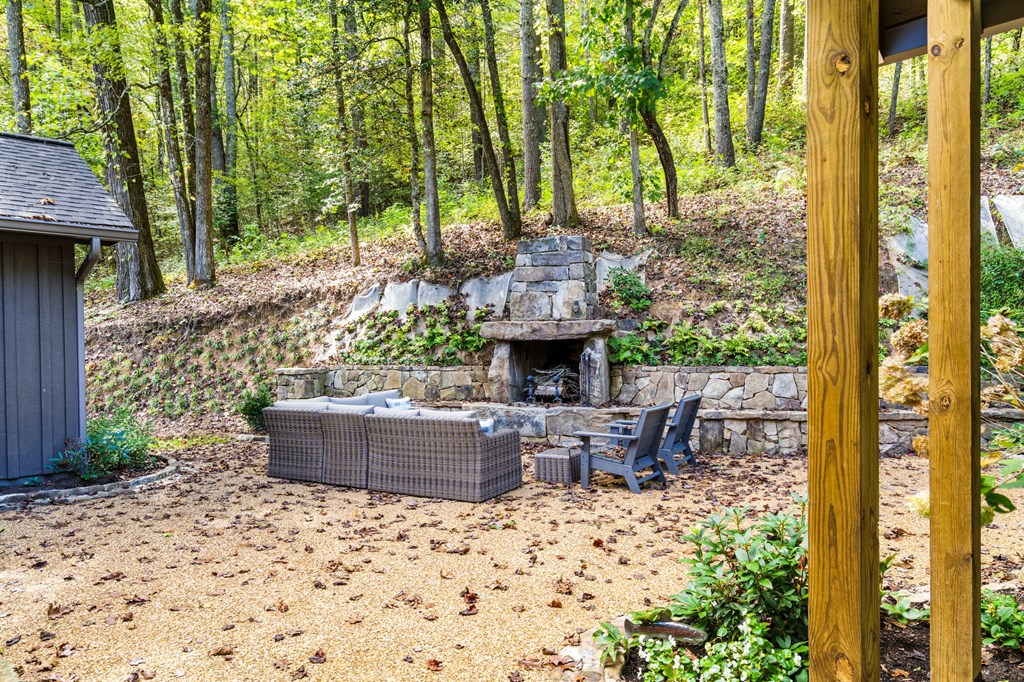 220 Haven Lane Murphy, NC 28906 - Photo 17 of 67 a view of a patio with table and chairs potted plants and large tree