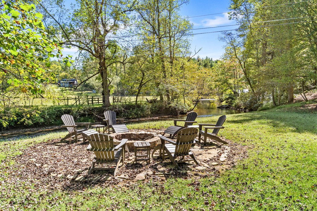 220 Haven Lane Murphy, NC 28906 - Photo 19 of 67 a view of a lake with a bench and trees
