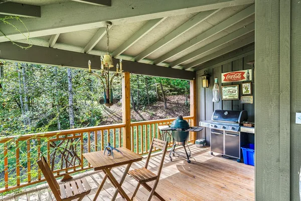 a living room with fireplace furniture and a flat screen tv