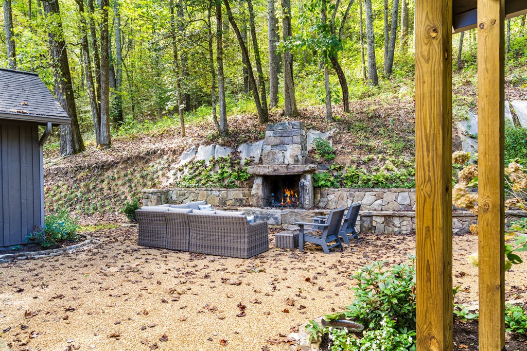 220 Haven Lane Murphy, NC 28906 - Photo 29 of 67 a view of a patio with table and chairs potted plants and large tree