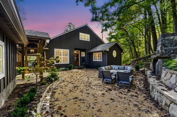 a view of a swimming pool and trees in the background