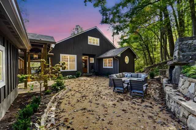 a view of a swimming pool and trees in the background