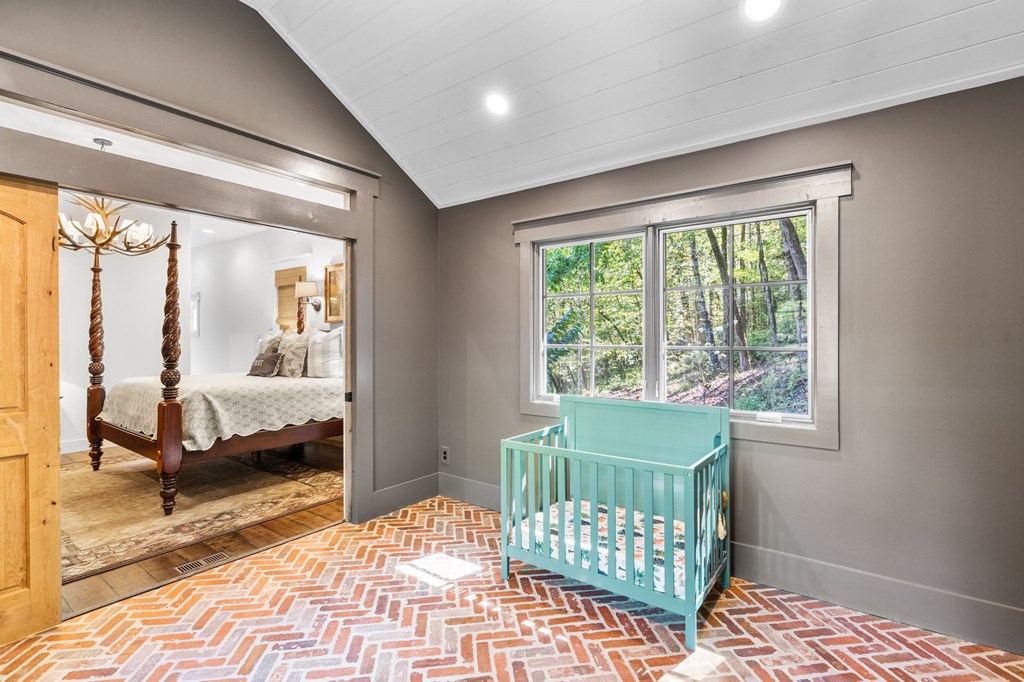 220 Haven Lane Murphy, NC 28906 - Photo 42 of 67 a bedroom with a bed and wooden floor