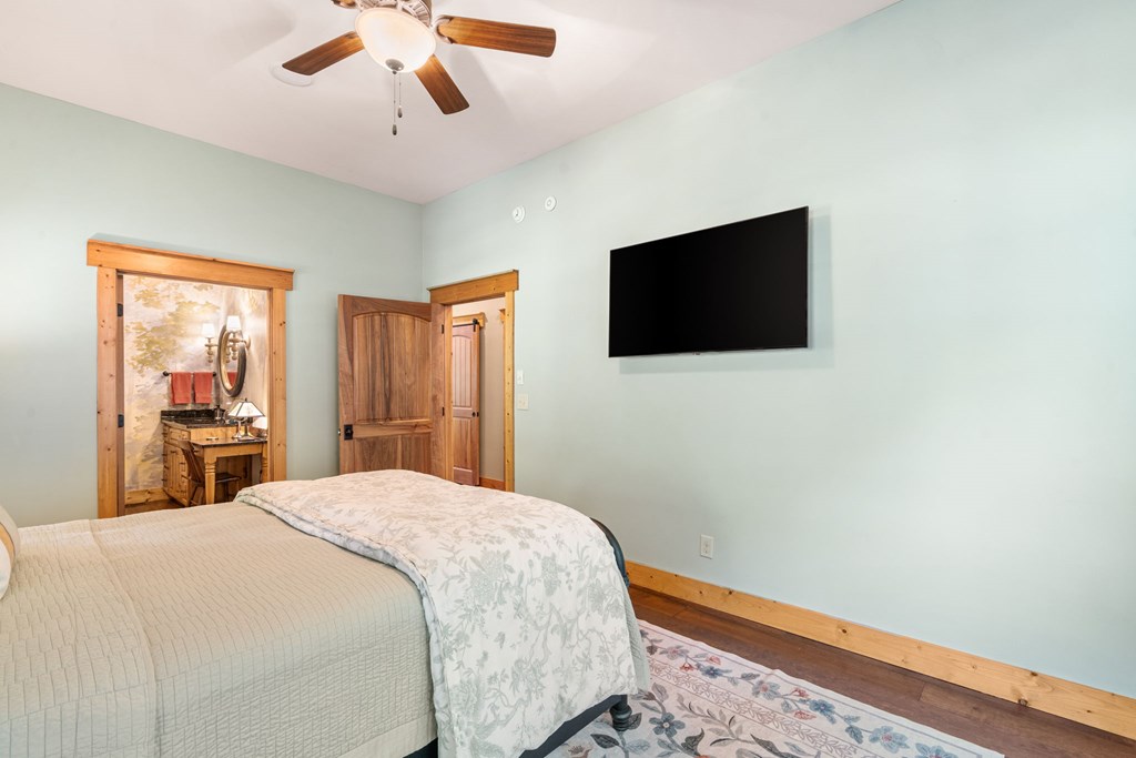 220 Haven Lane Murphy, NC 28906 - Photo 47 of 67 a bedroom with a bed and a flat screen tv