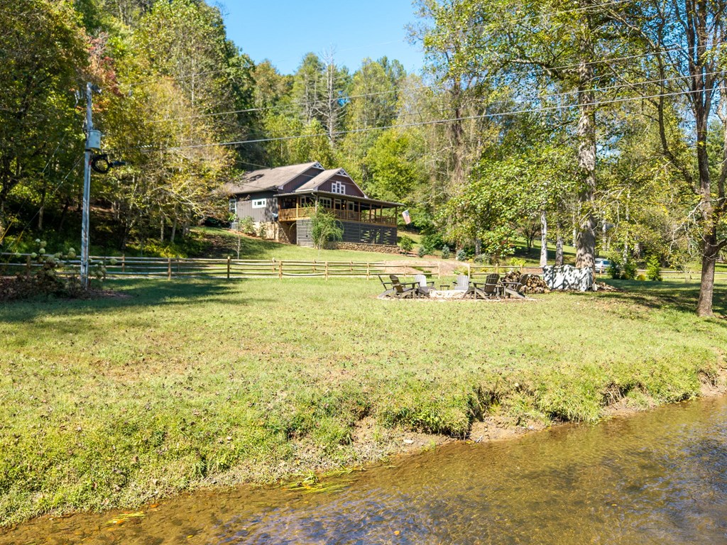 220 Haven Lane Murphy, NC 28906 - Photo 5 of 67 a view of a swimming pool and trees in the background