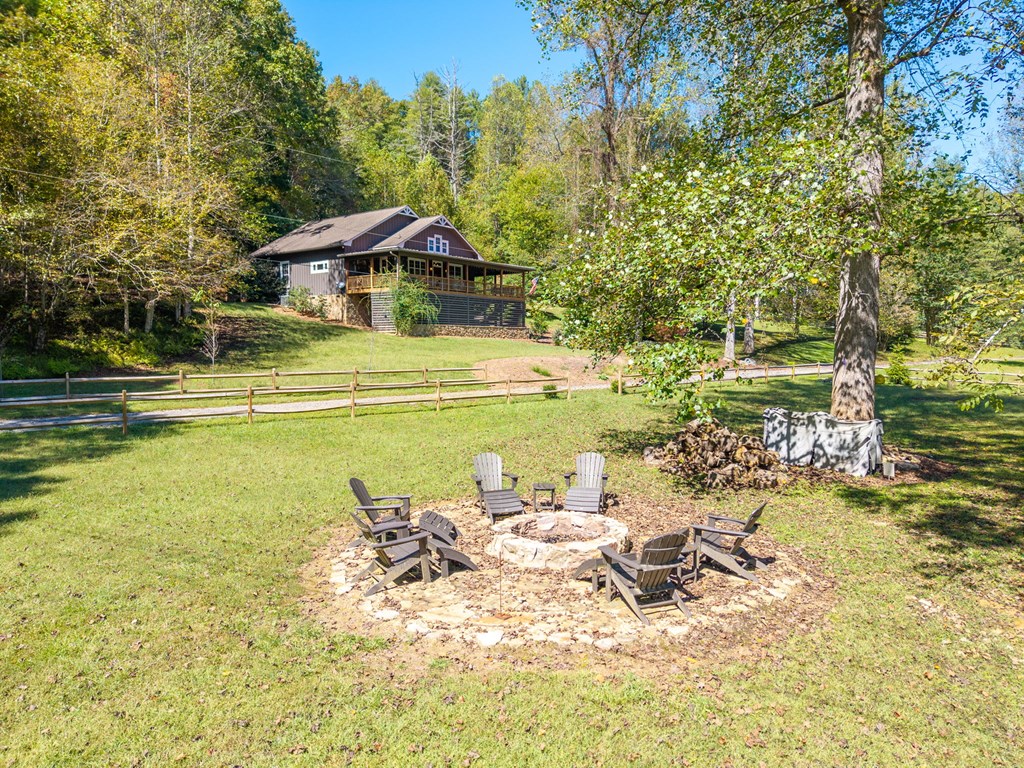 220 Haven Lane Murphy, NC 28906 - Photo 60 of 67 a view of a swimming pool with lawn chairs and plants