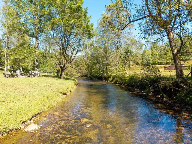 a kitchen with a table chairs and a refrigerator