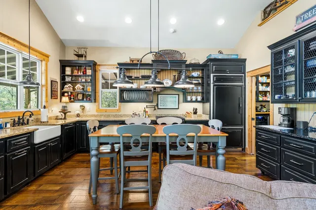 a view of a big yard with table and chairs and a yard