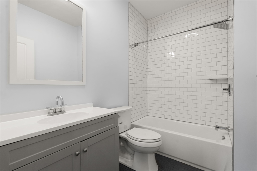 4 Wyoming Street, Unit 2 Boston, MA 02121 - Photo 18 of 23 a bathroom with a sink a toilet and shower