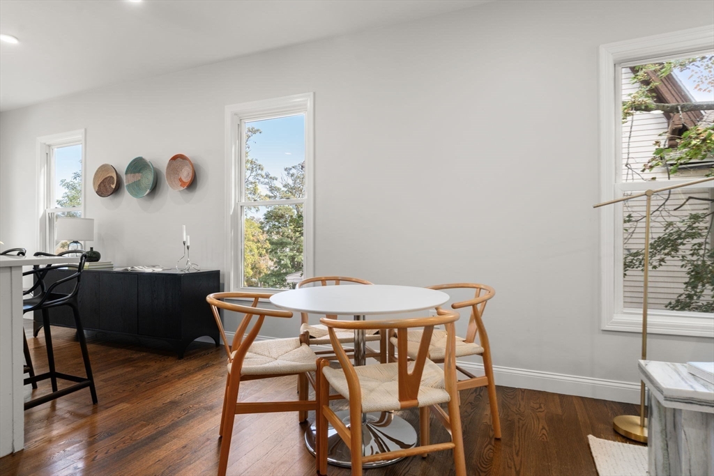 4 Wyoming Street, Unit 2 Boston, MA 02121 - Photo 5 of 23 a view of a dining room with furniture and wooden floor
