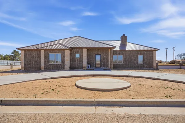 a front view of a house with swimming pool