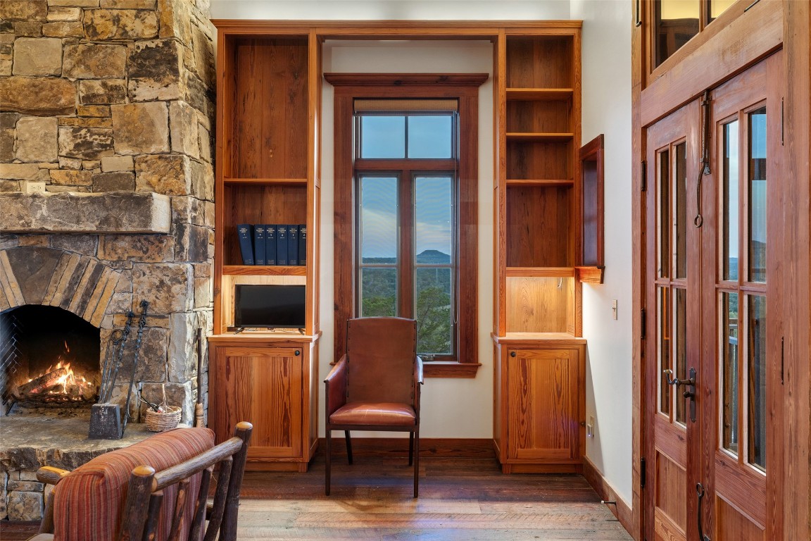 3503 Althaus-Davis Road Fredericksburg, TX 78624 - Photo 15 of 40 a living room with furniture and a fireplace