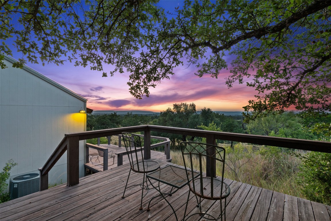 3503 Althaus-Davis Road Fredericksburg, TX 78624 - Photo 35 of 40 a view of a balcony with wooden floor and outdoor seating