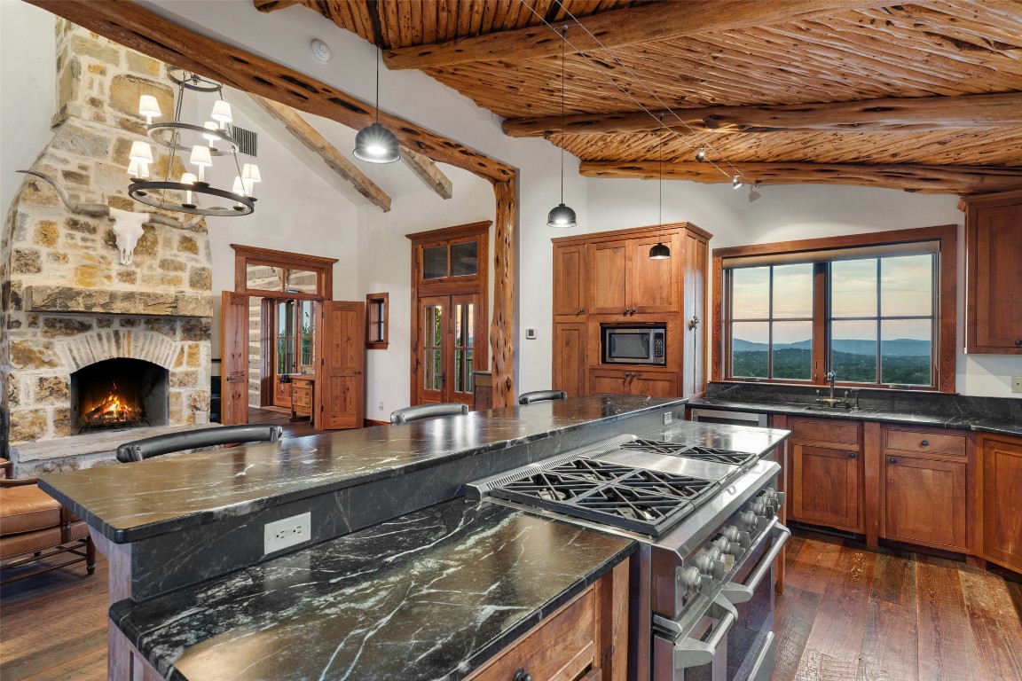 3503 Althaus-Davis Road Fredericksburg, TX 78624 - Photo 10 of 40 a living room with furniture and a fireplace