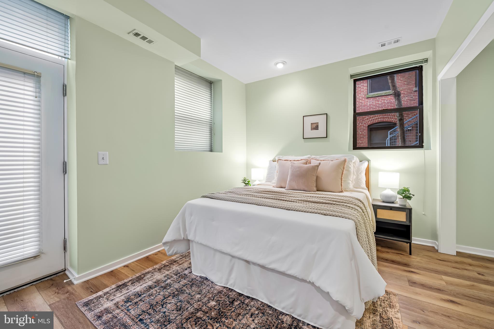 1211 Light Street, Unit 103 Baltimore, MD 21230 - Photo 11 of 31 a bedroom with a bed and a window