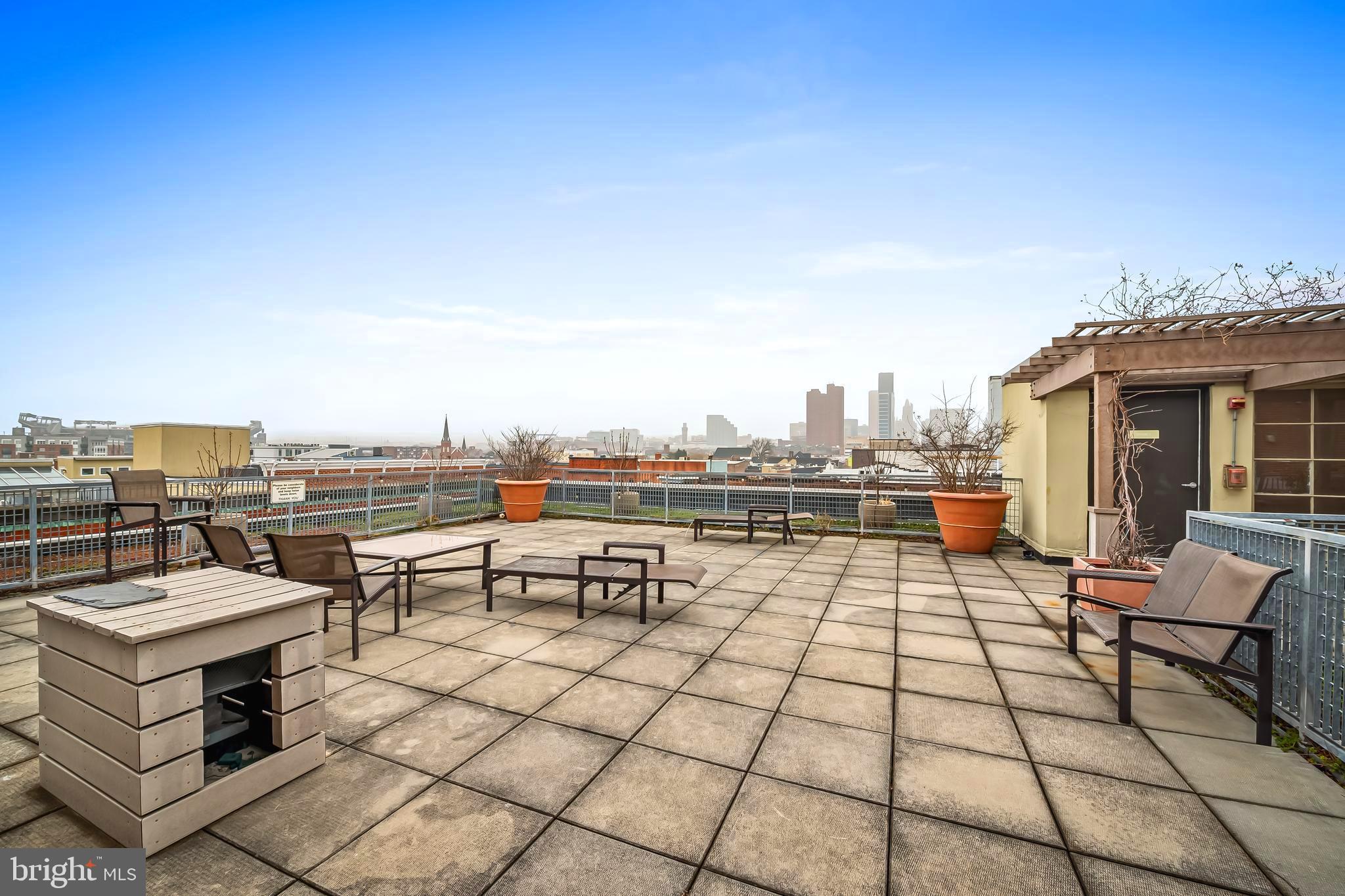 1211 Light Street, Unit 103 Baltimore, MD 21230 - Photo 20 of 31 a view of a terrace with sitting area