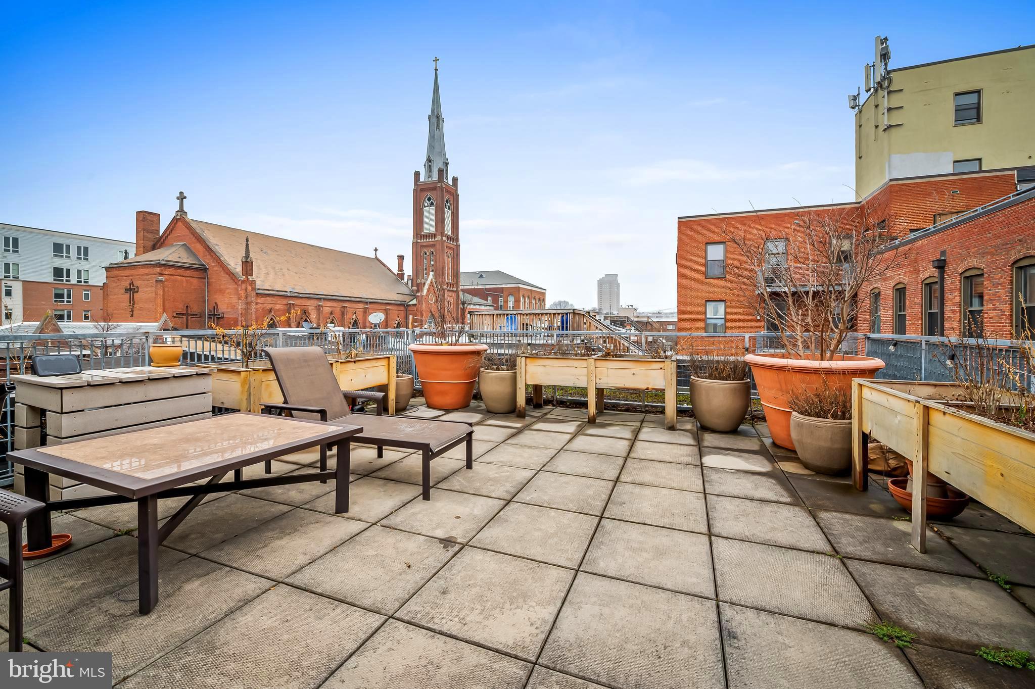 1211 Light Street, Unit 103 Baltimore, MD 21230 - Photo 22 of 31 a view of a terrace with seating area