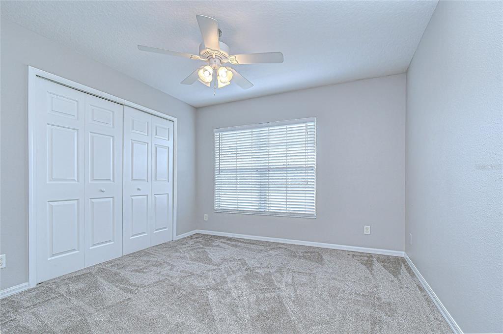 228 Hardcastle Place Valrico, FL 33594 - Photo 14 of 22 a view of an empty room with a window