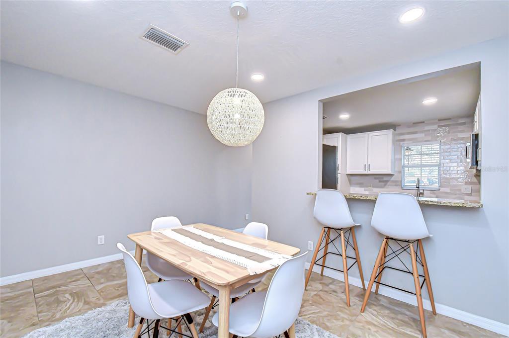 228 Hardcastle Place Valrico, FL 33594 - Photo 6 of 22 a view of a table and chairs in a room