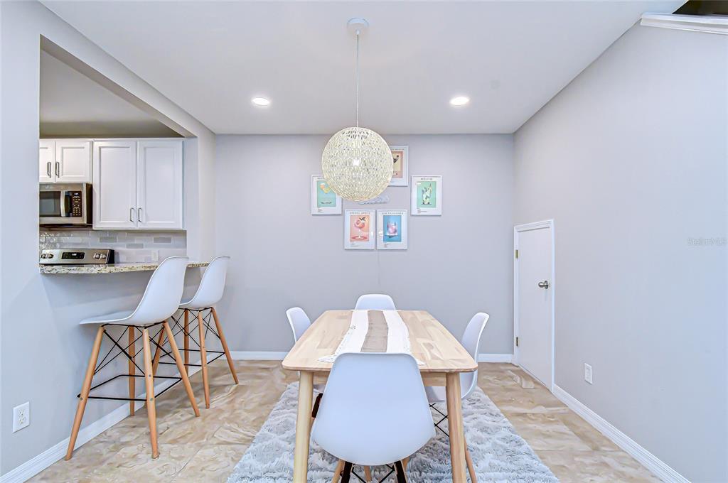 228 Hardcastle Place Valrico, FL 33594 - Photo 7 of 22 a view of kitchen with furniture and wooden floor