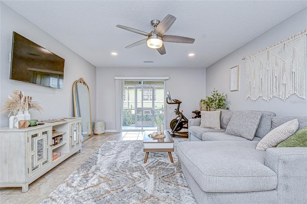 228 Hardcastle Place Valrico, FL 33594 - Photo 8 of 22 a living room with furniture and a flat screen tv