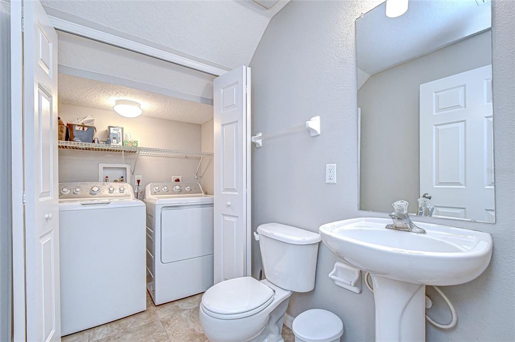 228 Hardcastle Place Valrico, FL 33594 - Photo 10 of 22 a bathroom with a sink toilet and a mirror