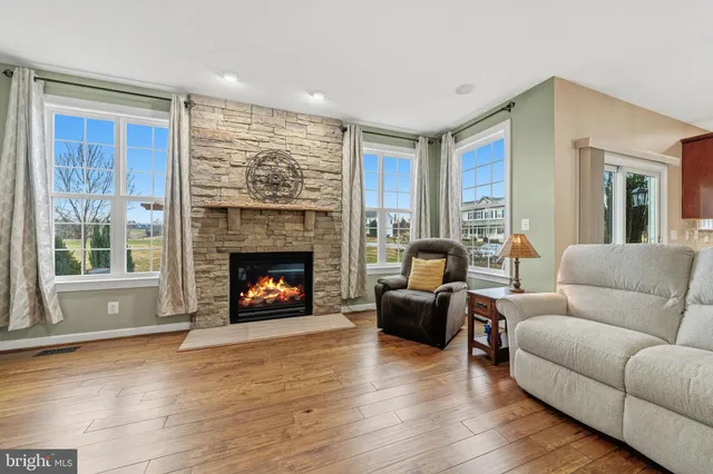 a spacious bedroom with a bed and a large window